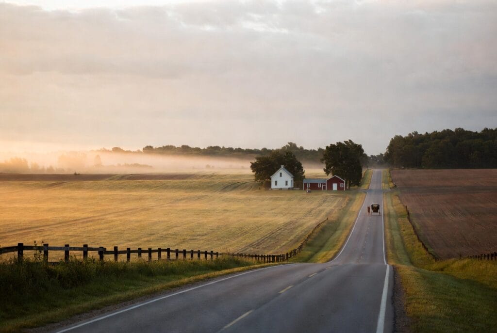 Rural farmhouse on open farmland along a country road in St. Mary's County Maryland